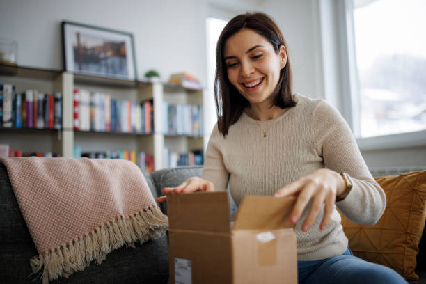 Woman opening her discreetly shipped medication package at home