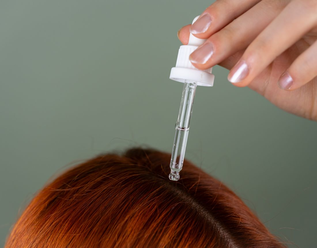 Serum being applied to the scalp to support hair quality